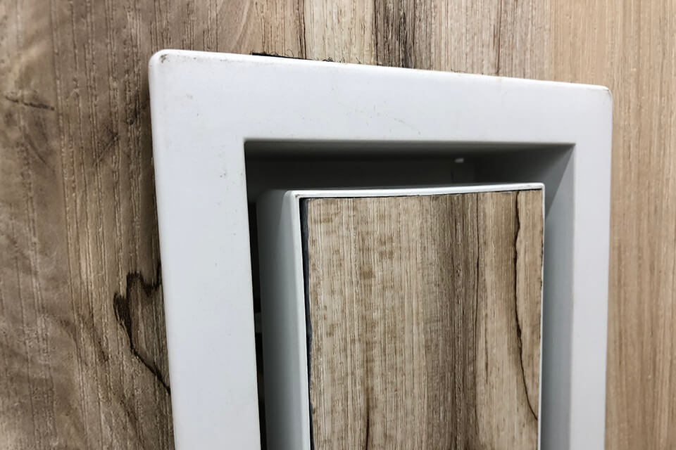 Aria vent displayed at Home Depot. Gaps are clearly visible around the edges.